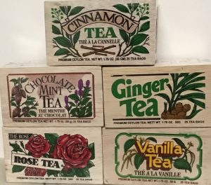 Cinnamon, Chocolate mint, ginger, rose and vanilla black tea bags in a softwood chest.