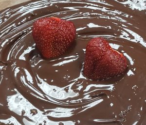 Ontario Strawberries being covered in milk chocolate